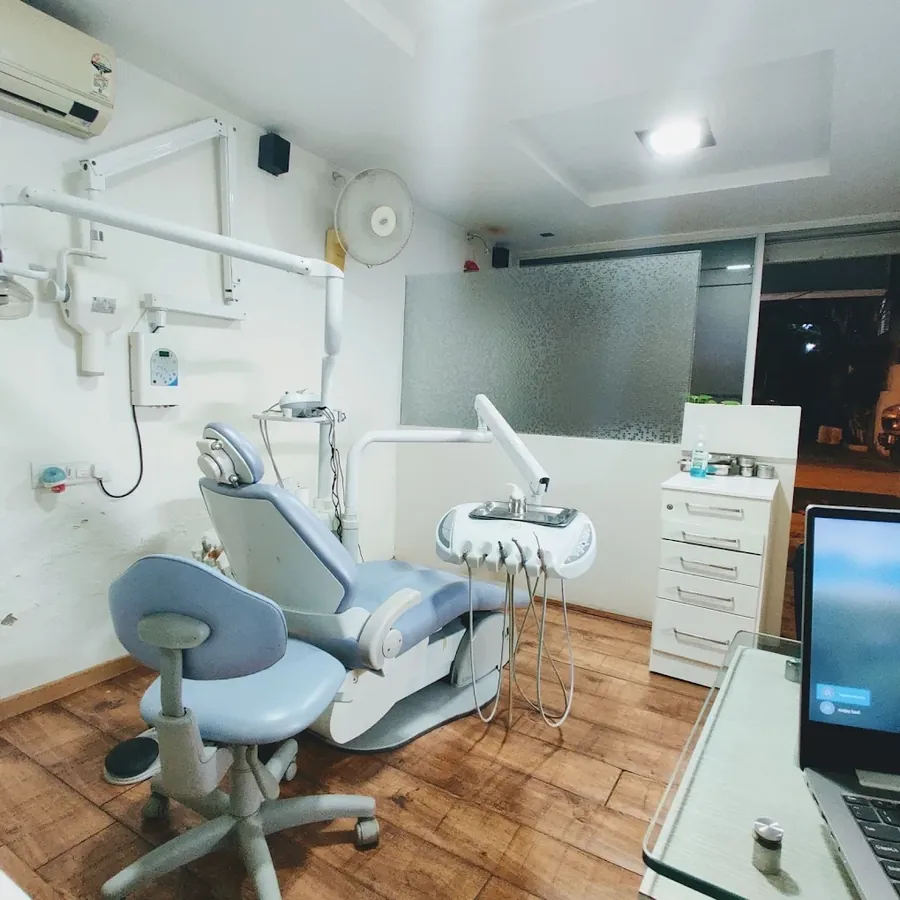 A treatment room at V-Care Dental in Koramangala with a dental chair, instrument unit and wall-mounted X-ray unit